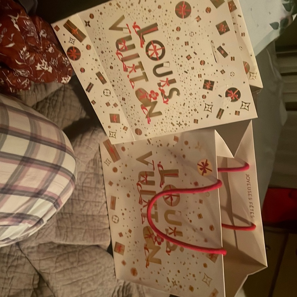Louis Vuitton, one med size and the other small. Christmas present was inside
